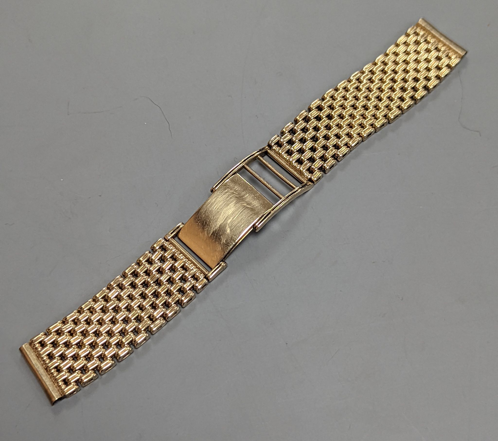 A 1960's 9ct gold watch strap, 15.5cm, with spare link